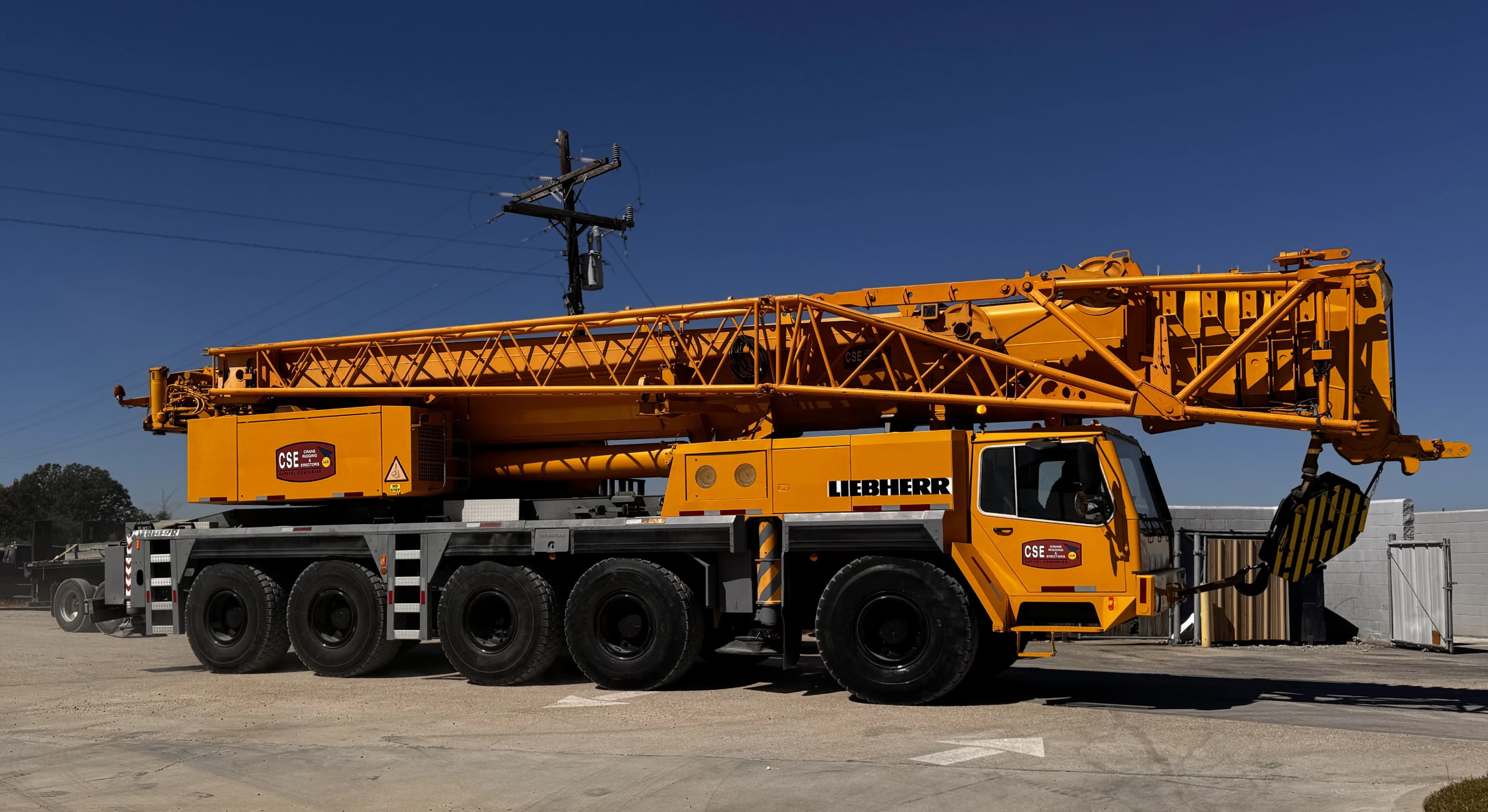Capitol companies Liebherr crane truck driving on dirt