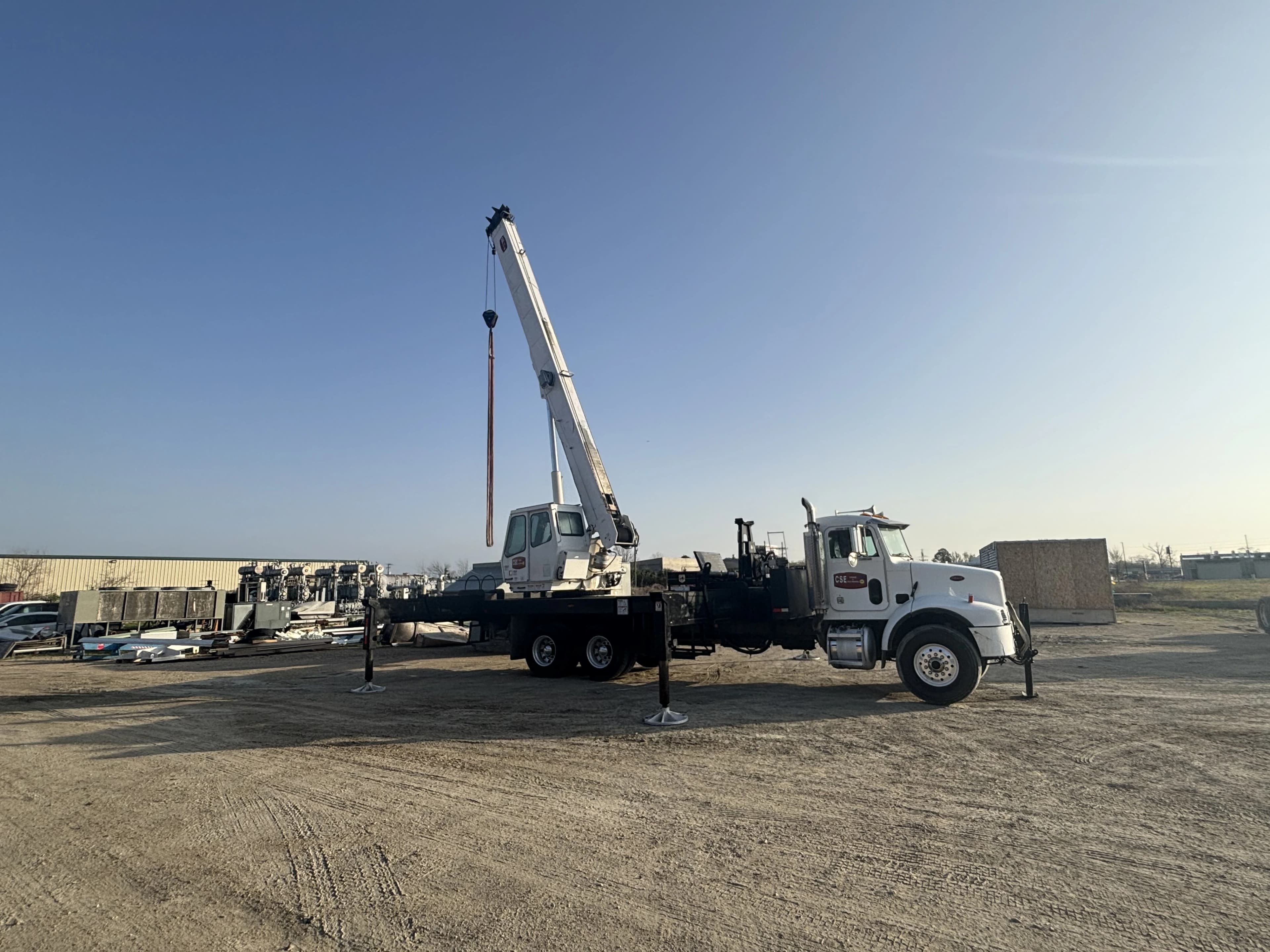 Capitol companies Crane truck sitting on yard extened outward