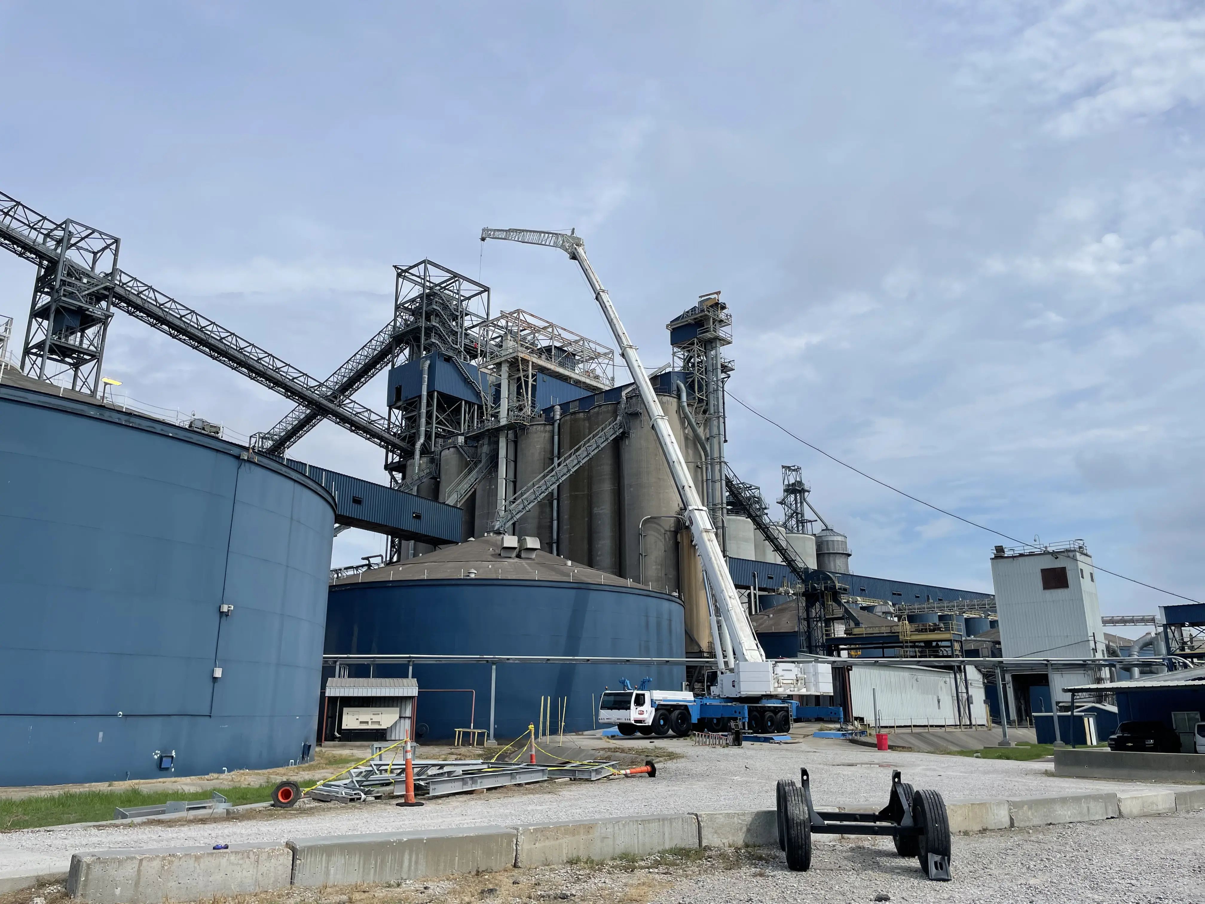 Large Crane moving a cooling tower at a plant